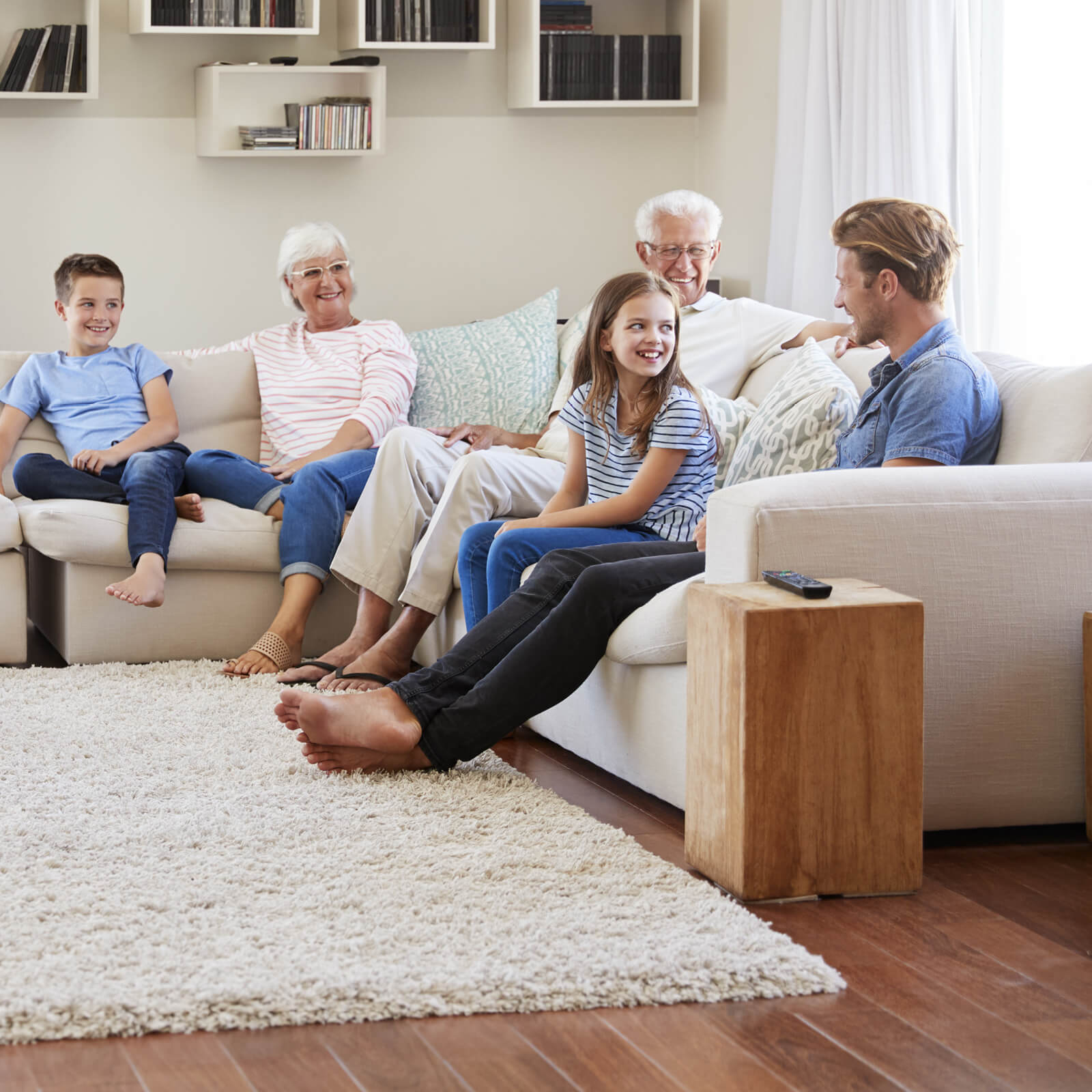 Family enjoying in living room | Jubilee Flooring & Decorating