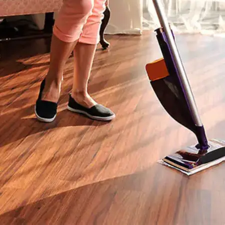 laminate-care-op-66a7775ea4291 (1) Lady cleaning laminate floor | Jubilee Flooring & Decorating